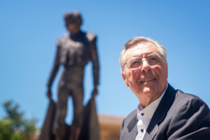 Portrait of Tom Boxwell in front of the Matador Statue.