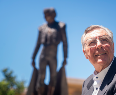 Portrait of Tom Boxwell in front of the Matador Statue.
