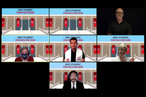 CSUN President Harrison encourages students to participate in the November elections by putting on a face mask with the word "VOTE."