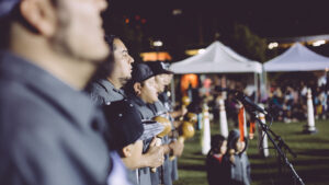 Tataviam tribal members stand in a line at downtown Los Angeles' Grand Park, singing and giving a blessing at the 2016 L.A. Pow Wow.
