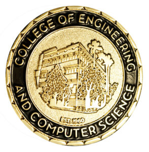 A gold "Challenge Coin" for the College of Engineering and Computer Science features an image of CSUN's Jacaranda Hall.