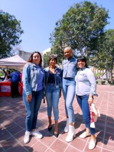 Four women dressed in denim.