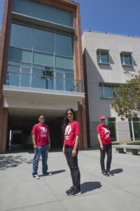 Three people in red Matadors Forward shirts