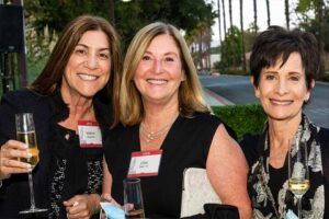 The female guests pose for a photo.