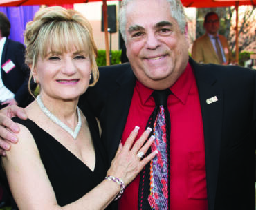 Harriet and Harvey Bookstein standing together outside Bookstein Hall