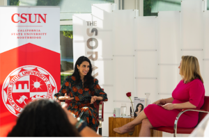 Huma Abedin sitting down and talking to President Beck