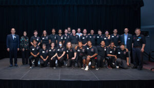 Group photo of winning aeronautics team with faculty members on each side.
