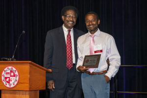 Stanley Thermidor holding award with William Watkins