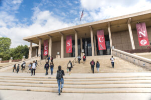 Students walking up the steps of the University Library.