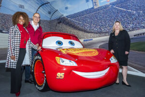 CSUN President Erika D. Beck, Michael Neubauer and Theresa White stand with Red Car known as Lightning McQueen in the Disney Pixar Films Cars.