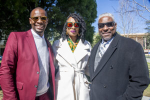 Ryan Mason, Marquita Gammage and Cedric Hackett stand together, smiling.