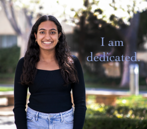 Photo of Mitul Kalra looking directly at camera with the text, "I am dedicated" on the image.