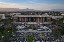 A drone camera captures the sunset over CSUN's final Commencement ceremony of 2022.