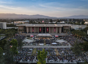 A drone camera captures the sunset over CSUN's final Commencement ceremony of 2022.