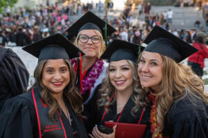 A group of students take a group shot during the second College of Health and Human Development ceremony.