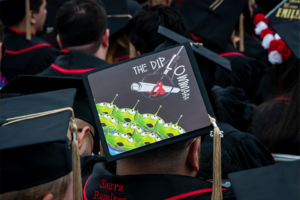 Mortarboard features the little green men from "Toy Story" saying "Diploma"