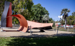 Artist Jan Peter Stern's "Steel Sculpture Group," a large, black-and-orangey red, four-piece outdoor sculpture.