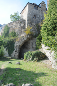 cavesite underneath stone castle
