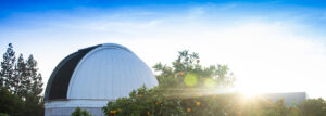 One of CSUN’s two observatories peeks through the trees in the Orange Grove