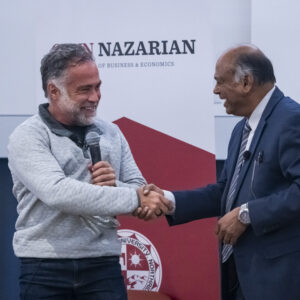 R. Martin "Marty" Chavez shakes hands with Chandra Subramaniam, dean the David Nazarian College of Business and Economics.