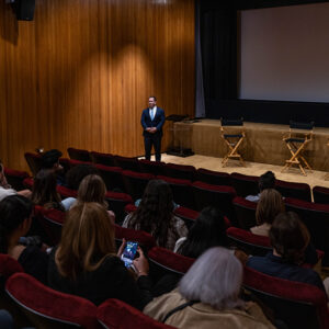 Zach Sokoloff, senior vice president at Hackman Capital Partners, speaks at a screening of CSUN products on March 26.