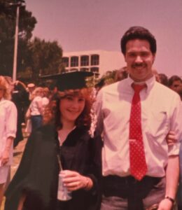 Kelley Rivera, in cap and gown, with Peter Rivera at CSUN.