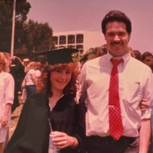 Kelley Rivera, in cap and gown, with Peter Rivera at CSUN.