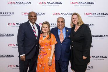Four people in front of a CSUN Nazarian College step-and-repeat.