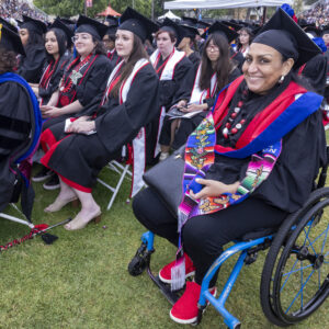 Graduates seen in the audience during a commencement ceremony.