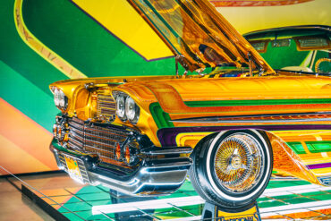 A photo of the front end of 1958 Chevrolet Impala- Final Score, the chassis is gold with yellow, green and red stripes.