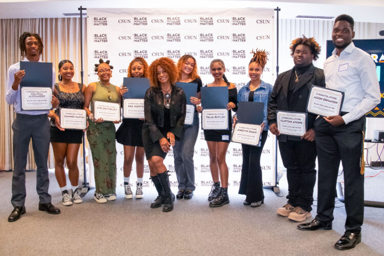 Black Scholars Matter Cohort 3 students pose with their certificates with Director Theresa White in the center.