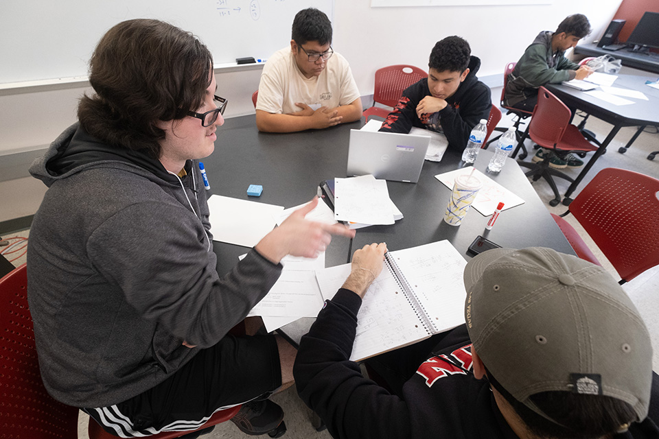 CSUN students study at a table in a math tutoring center.