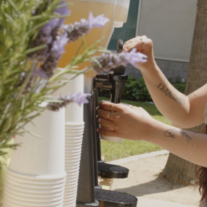 A student pours tea into their cup.