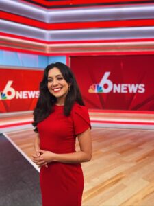 Xochitl Hernandez stands in the NBC 6 News studio, smiling