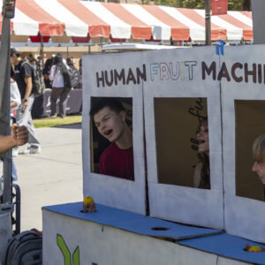 Students participating in a DIY human fruit machine.