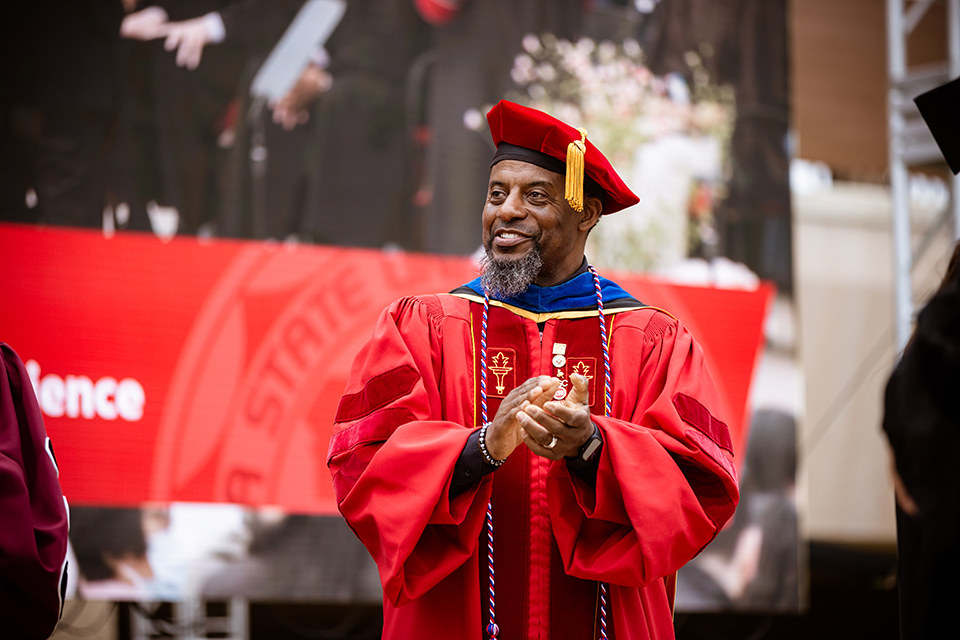 Prof. Boris Ricks in a cap and gown at CSUN commencement