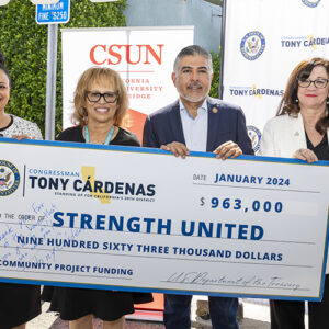 Shefali Mistry, Merilla Scott, Tony Cardenas and Shari Tarver Behring stand behind a giant ceremonial check.