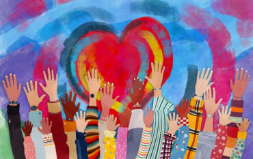 Group of diverse hands reaching for a heart