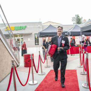 Dan Hosken, dean of the Mike Curb College of Arts, Media and Communication, walks the red carpet into the ceremony.