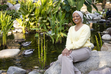 Rashawn Green, sits by the side of the duck pond.