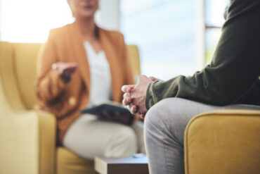Man talking to a therapist.