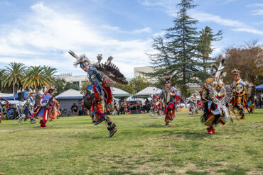 Dancers in traditional regalia.