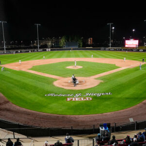A wide shot from behind home plate of the first CSUN Baseball night home game.