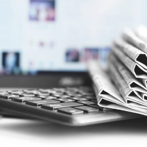 Newspapers and Laptop