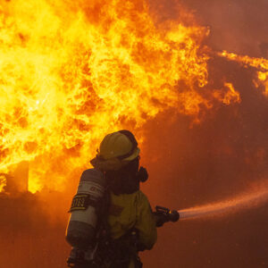 A firefighter battles the fire as the Palisades fire burns in Pacific Palisades, the west side of Los Angeles, January 7, 2025. (Ringo Chiu / CSUN)