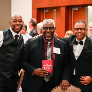 CSUN Faculty Athletic Representative and former football player Cedric Hackett stands in the middle with old friends as they gather to honor the legacy of Joseph Vaughn.