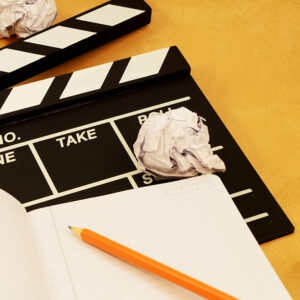 A focused image on the theme of filmaking and the writing of a script