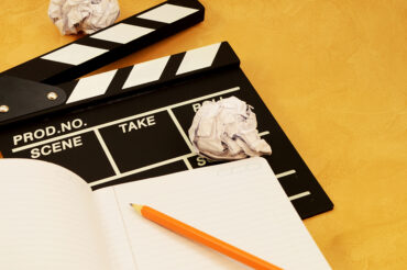 A focused image on the theme of filmaking and the writing of a script