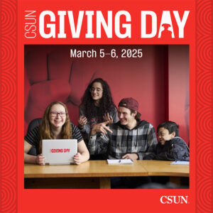 Students gathered around computer with "Giving Day" graphic.