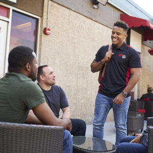 Several students gather to talk outside of CSUN's Veterans Resource Center.